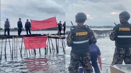 Petugas Bersenjata Lengkap dari KKP Segel Pagar Laut Misterius Sejauh 30 KM di Tangerang