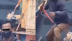Aksi nekat seorang "bajing loncat" yang mencuri besi dari truk trailer di lampu merah Permai, Jakarta Utara, membuat geger para pengendara yang melintas.