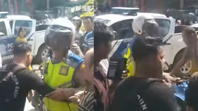 Viral di media sosial, sebuah video memperlihatkan seorang pria tak terima ditilang dan motornya dibawa personel Polisi Lalu Lintas (Polantas) Polres Nias Selatan, Sumatera Utara.