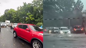 Hujan deras menyebabkan banjir parah di Bintaro Utama, menghambat arus lalu lintas dan menciptakan kemacetan.