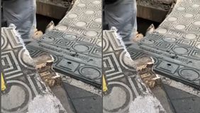 Truk yang parkir di atas trotoar mengakibatkan penutup gorong-gorong trotoar amblas di Jalan Jatinegara Timur, Jakarta Timur pagi tadi, Senin (23/6/2025).