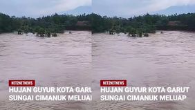 Sejumlah akun media sosial warga Garut mengunggah kondisi luapan debit air sungai tersebut .
