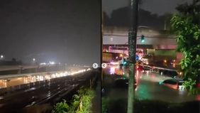 Salah satu titik terdampak berada di ruas Jalan Tol Baru Burangkeng, Setu. Air menggenangi jalur kendaraan, membuat lalu lintas tersendat dan kendaraan harus melambat untuk melewati area banjir.