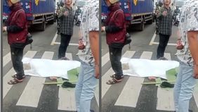 Pengendara sepeda motor Honda Beat F 5234 TZ berinisial TF (47) warga Citamiang, Kota Sukabumi, m3n1n994l dun14 di lokasi kejadian setelah terlindas truk boks A 9346 ZY di depan PT Daehan Global, Jalan Raya Sukabumi-Bogor, tepatnya Desa Karangtengah,