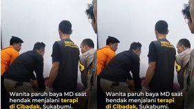 Berdasarkan keterangan pihak kelurahan dan keluarga, korban memiliki riwayat gangguan pernapasan dan penyakit jantung. Saat menaiki tangga menuju ruang terapi, wanita tersebut drop.