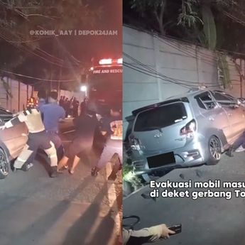 Evakuasi Menegangkan Mobil Terjeblos di Selokan Dekat Tol Kukusan Beji