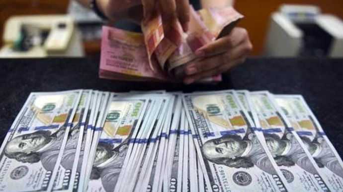 Mata uang Rupiah dan Dolar AS/ist