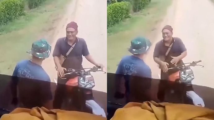 Seorang pria nekat menghadang truk alat berat