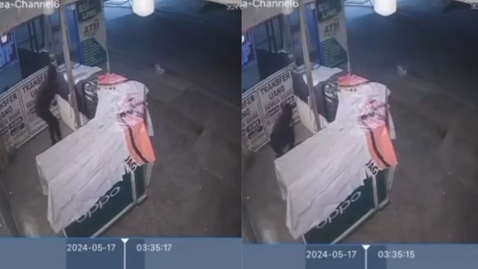 Seorang pria berpakaian serba hitam terekam CCTV berusaha membobol Toko Hp