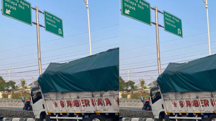 Truk menyangkut di pemisah flyover