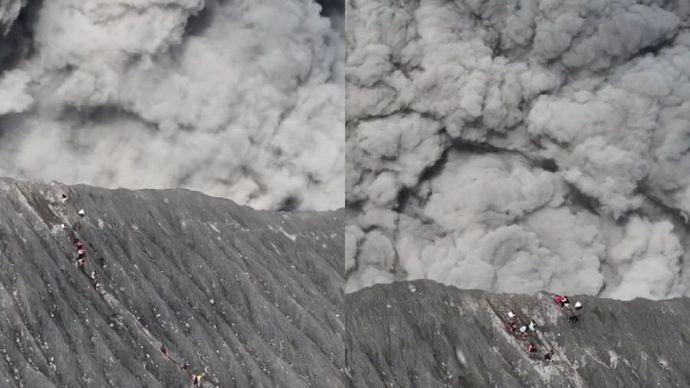 Belasan pendaki Gunung Dukono menyusuri jalur turun saat asap tebal dan abu vulkanik mulai mengepul dari kawah.