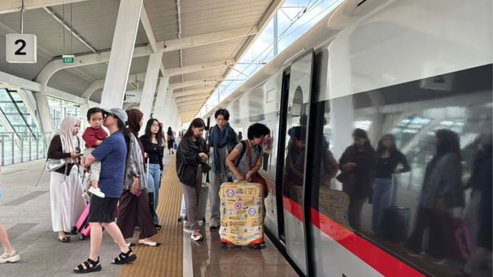 Stasiun kereta Woosh - Ilustrasi 