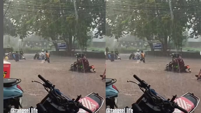 Hujan deras dengan itensitas tinggi sore ini memyebabkan beberapa titik di wilayah Tangsel tergenang banjir, Senin (7/7).