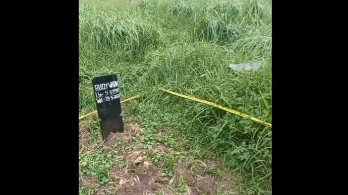 Makam yang disebut berisi jenazah Rudy Watak. 