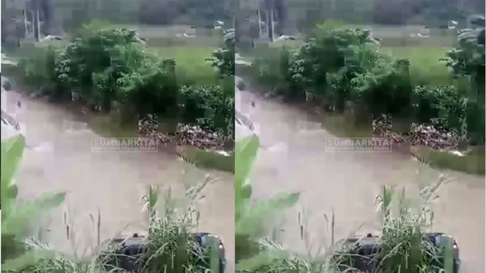 Dalam video yang beredar di media sosial, terlihat sebuah mobil Mitsubishi Pajero terjun ke sungai dan dalam posisi rebah kuda