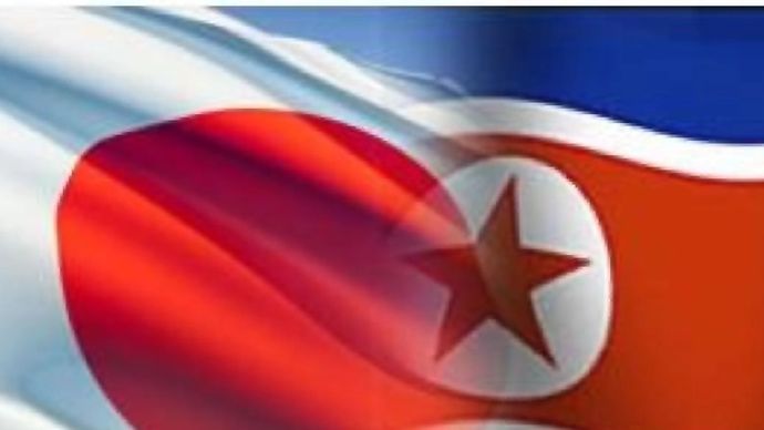 Ilustrasi bendera Jepang dan Korea Utara.