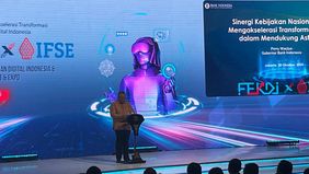 Gubernur Bank Indonesia (BI), Perry Warjiyo menyampaikan pencapaian luar biasa dalam adopsi Quick Response Code Indonesian Standard (QRIS).