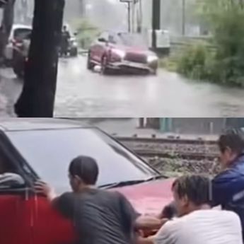 Nekat Terobos Banjir, Sebuah Mobil Nyungsep Masuk Selokan di Pesanggrahan