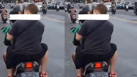 Sebuah video yang memperlihatkan warga negara asing (WNA) berciuman dengan seorang perempuan saat berboncengan tiga di atas motor menjadi viral di media sosial.